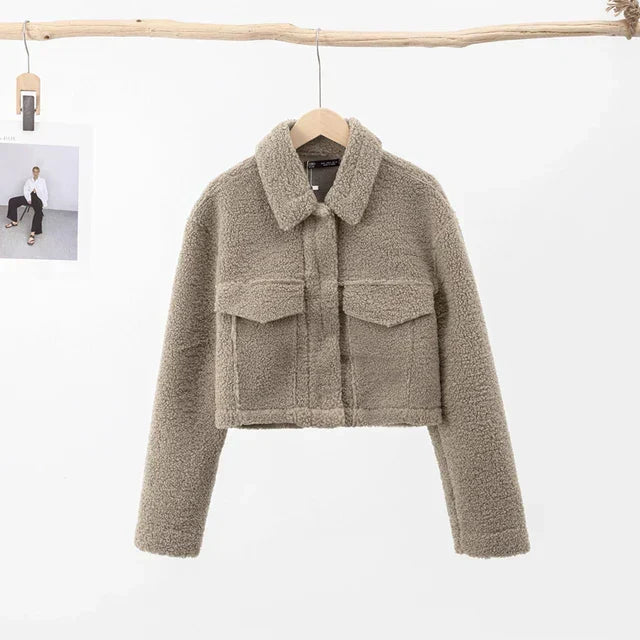Back view of stylish womens short winter jacket in beige