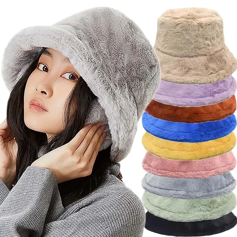 Woman wearing a grey plush bucket hat alongside a stack of colourful hat variants