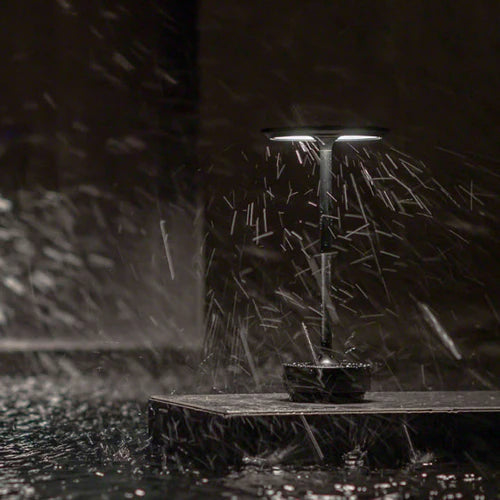 Modern touch sensor table lamp featured on an outdoor patio dining table