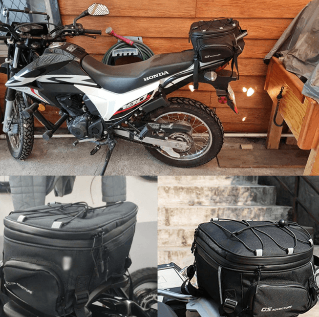 Durable black travel luggage bag resting on a motorcycle seat