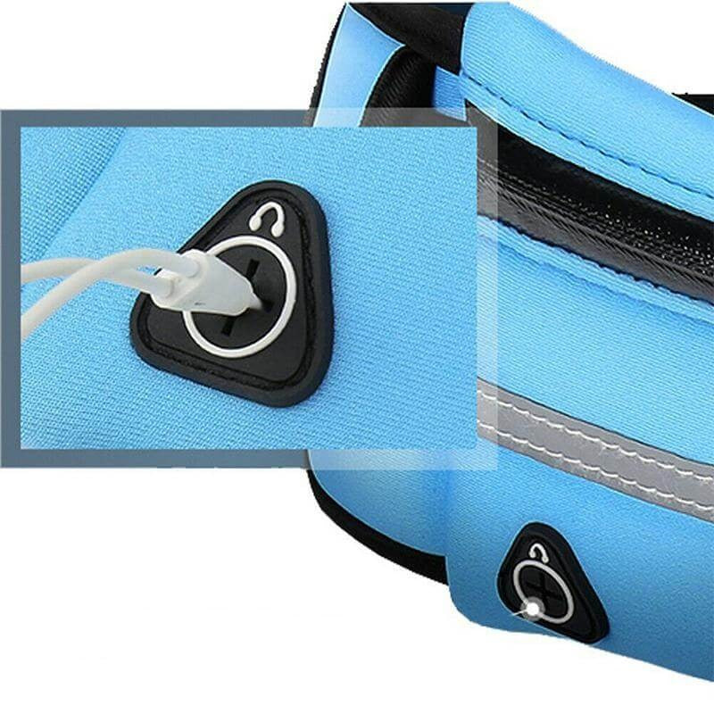 Runner wearing water-resistant running waist belt in park setting
