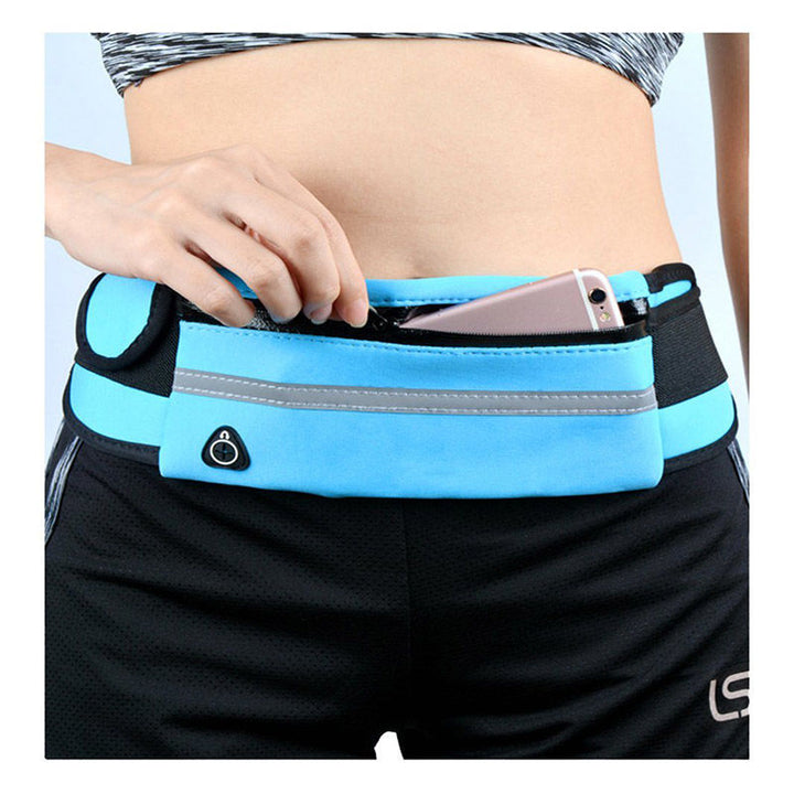 Compact fitness pouch shown with travel accessories and smartphone