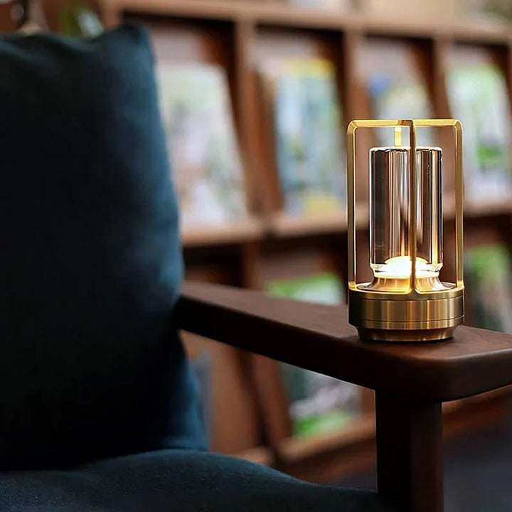 Crystal table lamp casting decorative light patterns on a wall