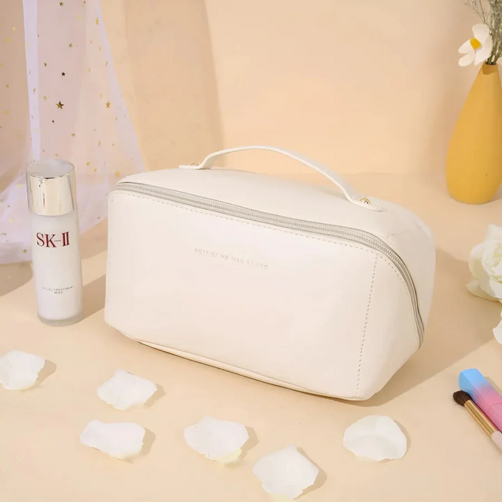 Durable waterproof material closeup on women's cosmetic travel bag highlighting easy-clean fabric.