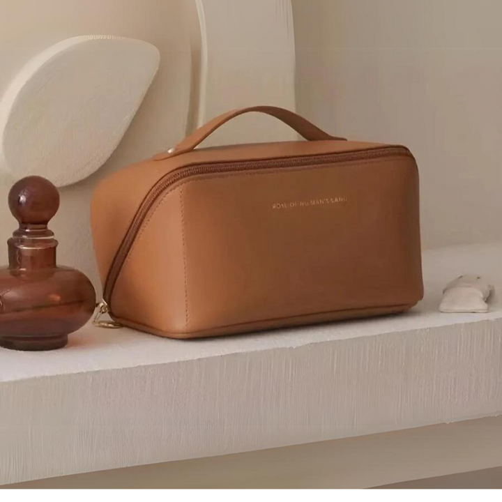 Travel toiletry bag packed with skincare bottles, demonstrating large capacity and organization.