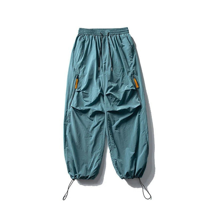 Unisex waterproof hiking pants showing taped seams and quick-dry fabric technology