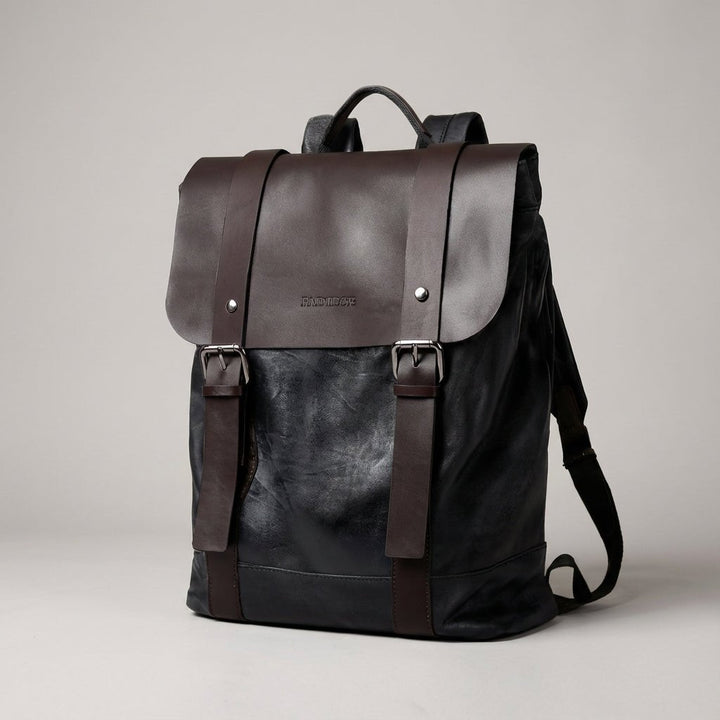 Dark brown and black waterproof laptop backpack studio shot