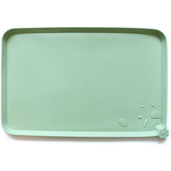 Mint green waterproof pet feeding mat with water droplets and raised edges