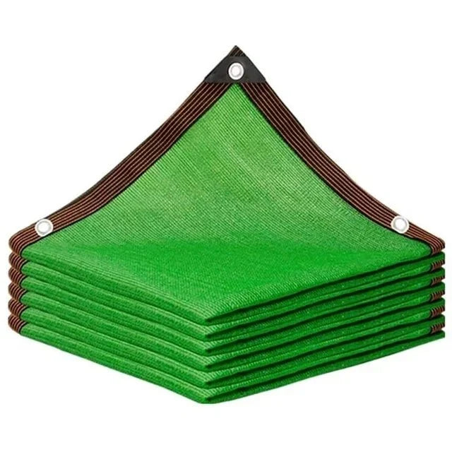 Green waterproof sail shading a garden lounge setup during summer