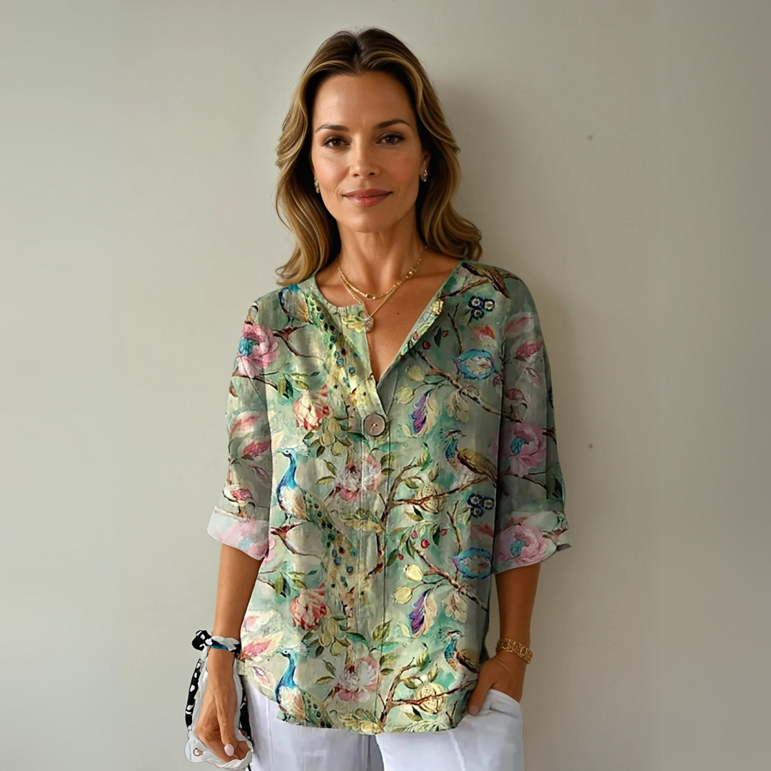 Woman modeling a green botanical floral print casual summer top