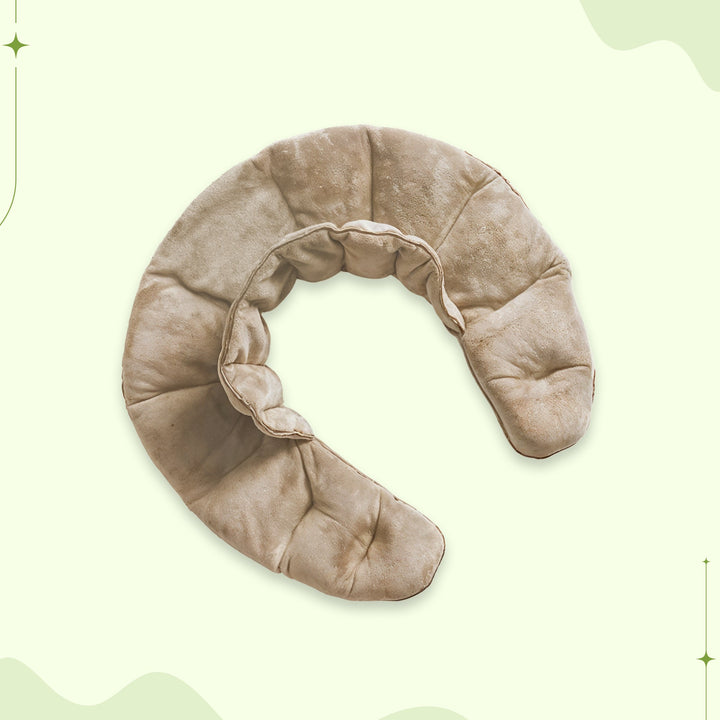 Beige weighted neck and shoulder wrap displayed flat on neutral background