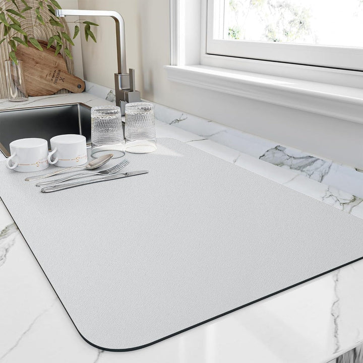 Absorbent diatomite mat used as a sleek kitchen sink organizer