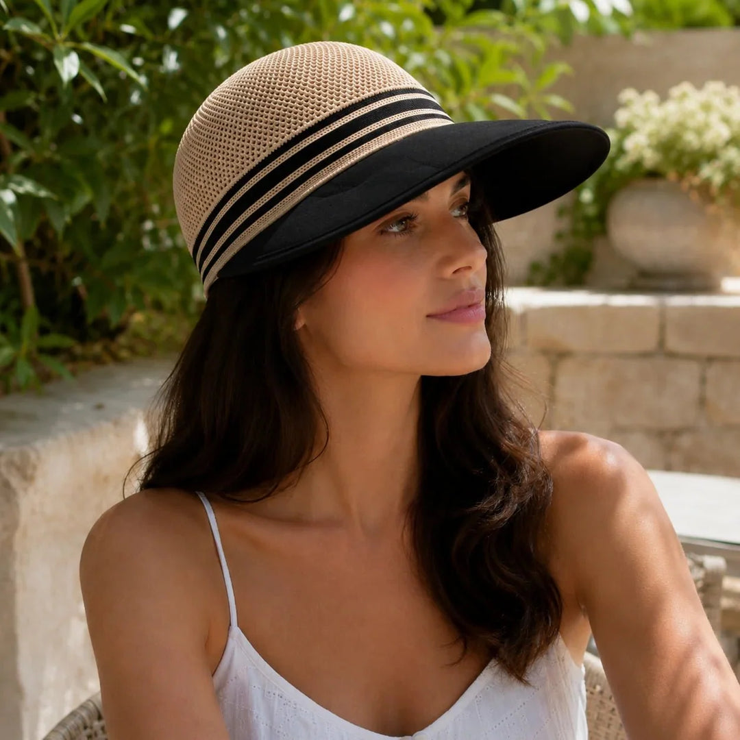 Woman wearing a stylish wide brim sun hat with breathable knit crown outdoors