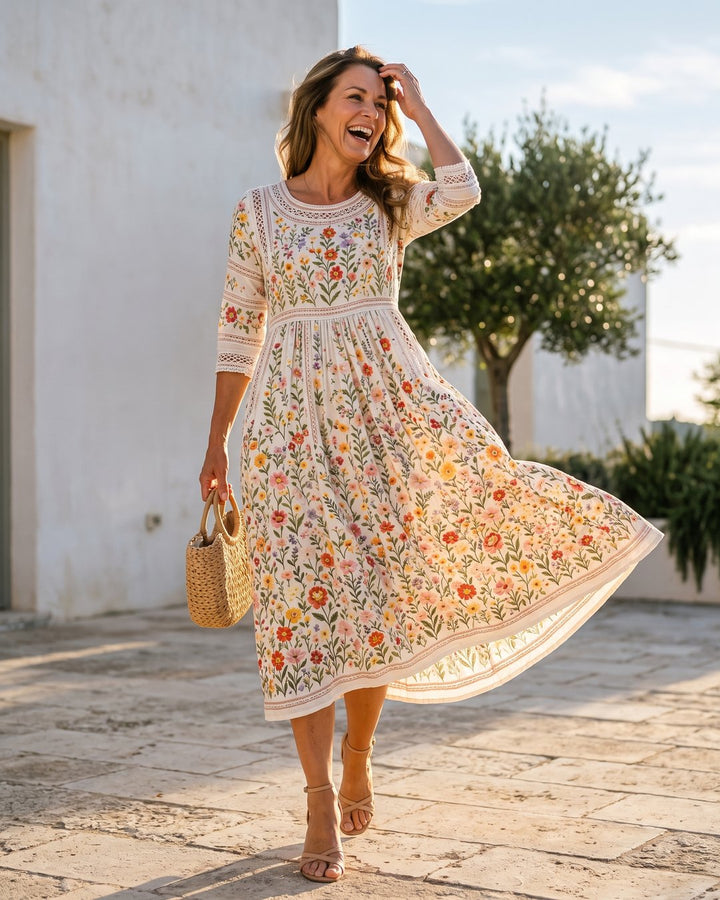 Lifestyle shot of a smiling woman walking outdoors while wearing the floral midi dress