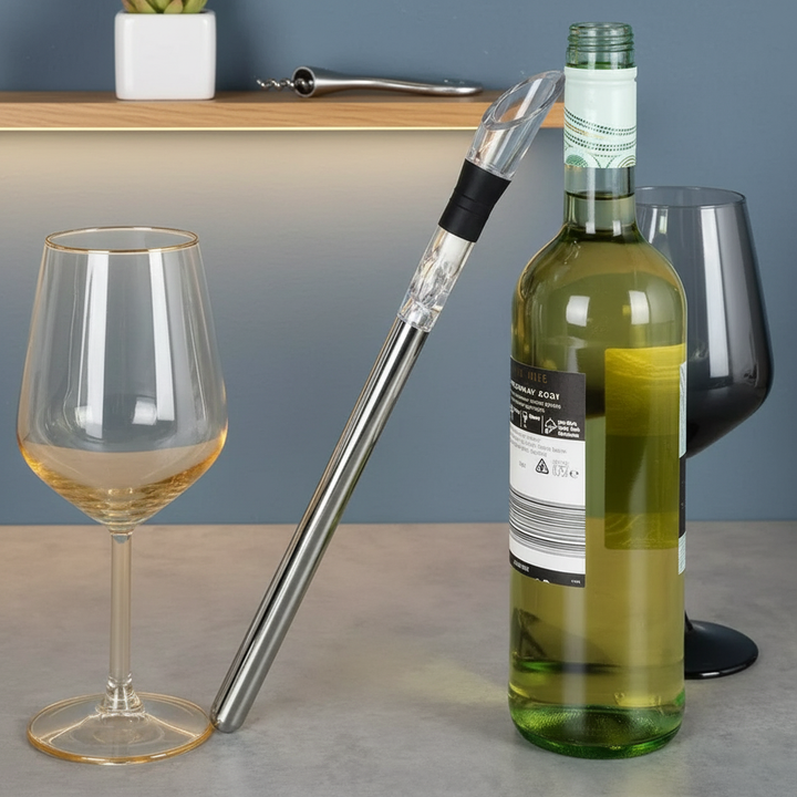 Stainless steel wine chiller rod cooling a bottle of white wine