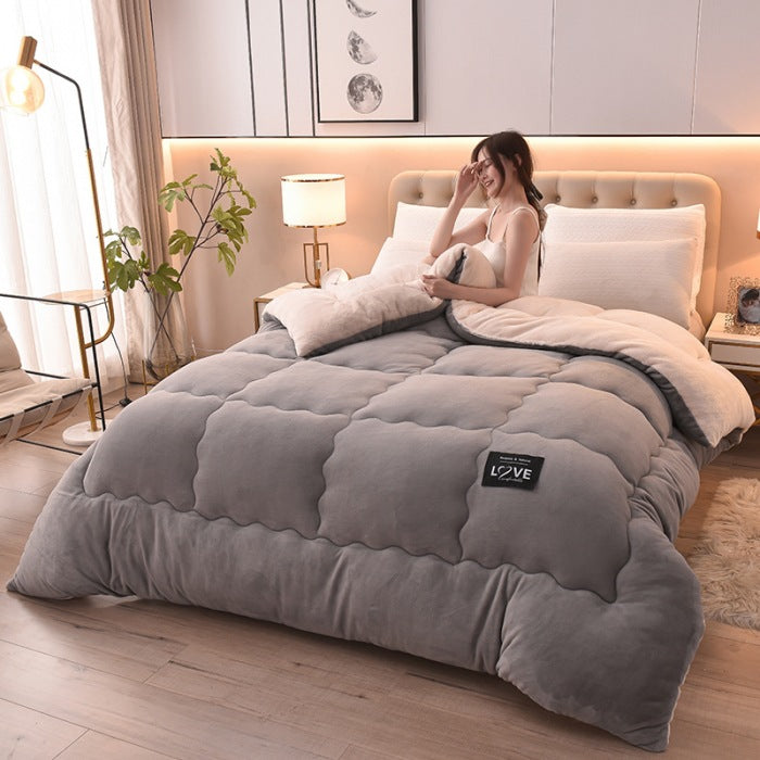 Warm comforter styled on a modern bed for inviting bedroom decor