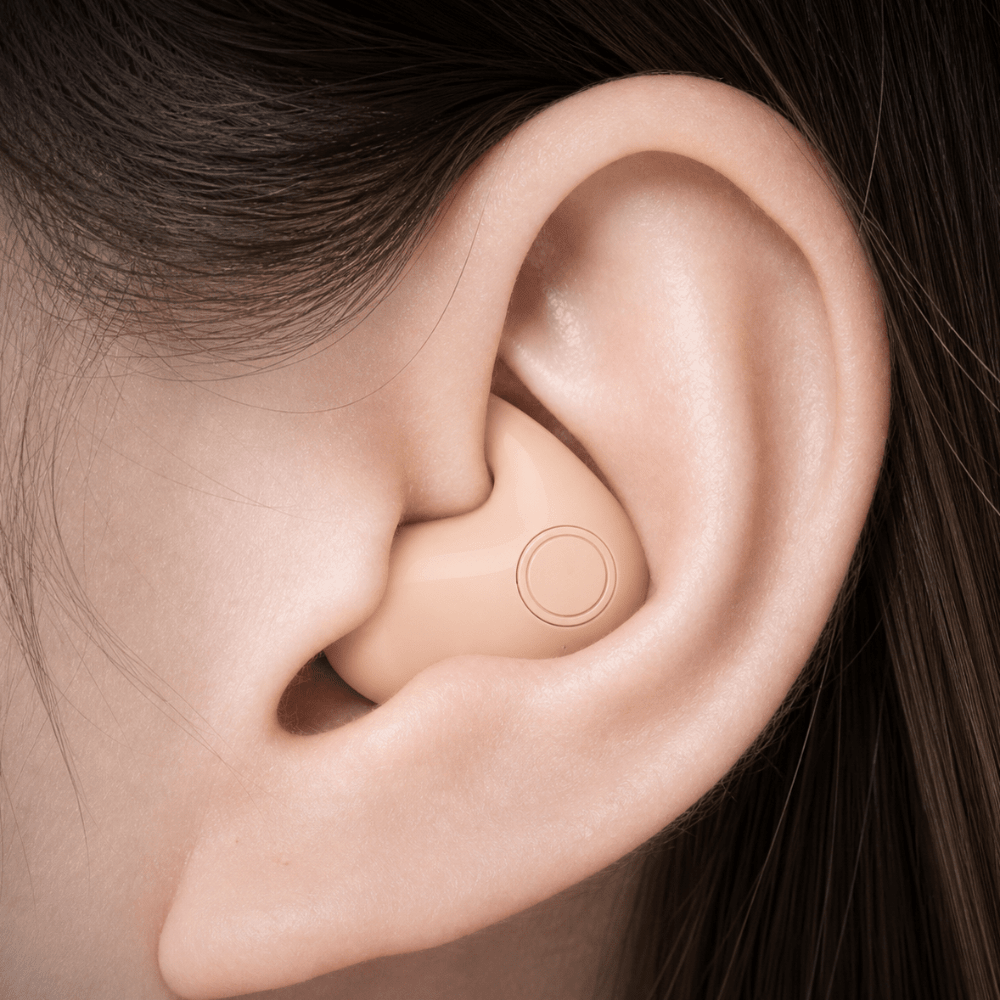 Noise cancelling wireless earbuds shown with compact charging case