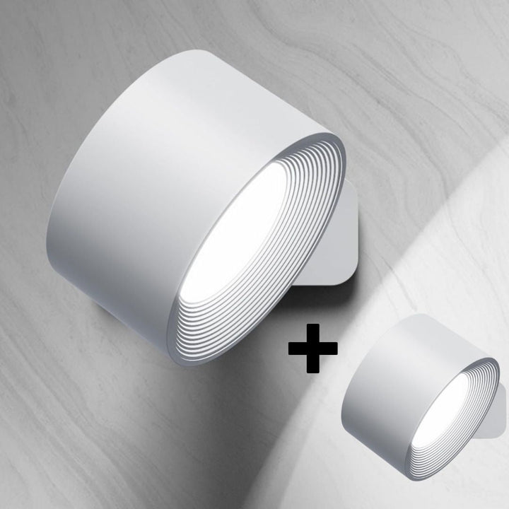 White wireless LED wall light mounted on a wall surface