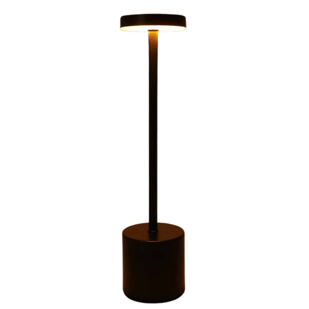 Black wireless metal LED table lamp against a neutral background