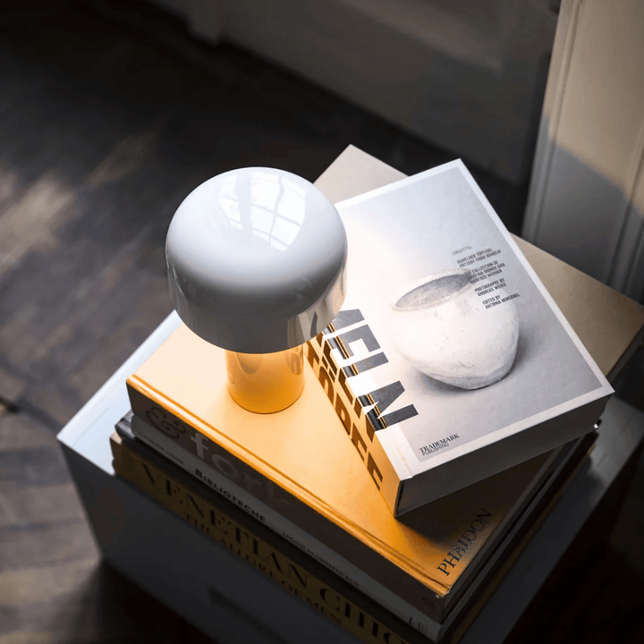 Rechargeable metal desk light showcasing adjustable touch dimming control feature
