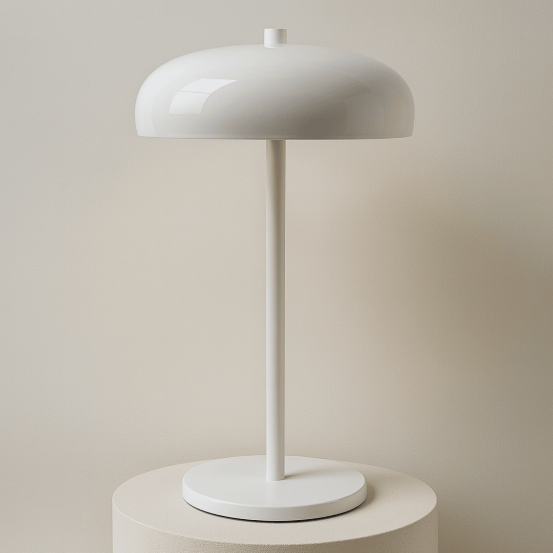 Modern white wireless table lamp on display pedestal