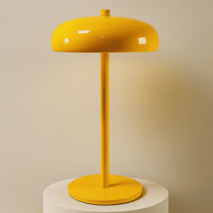Wireless table lamp illuminating a cozy modern bedside table