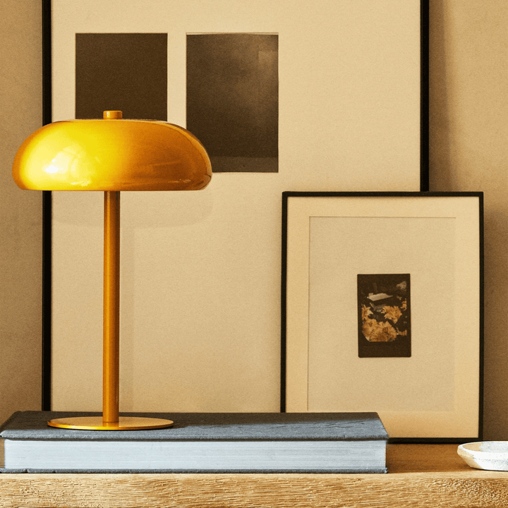 Dimmable LED lamp casting a warm glow on a minimalist office desk