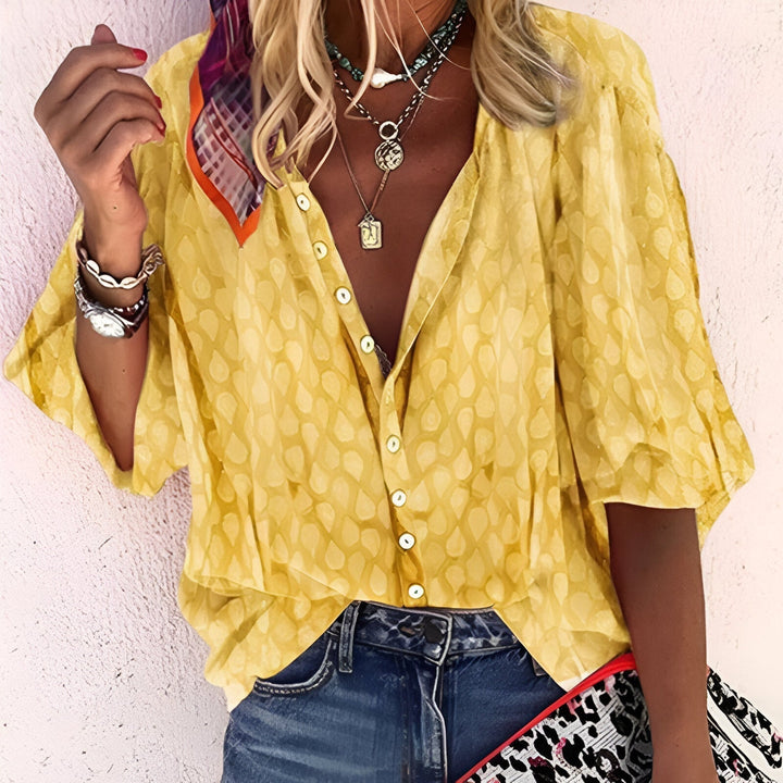 Chic women's button-up blouse with 3/4 sleeves in relaxed fit for everyday wear