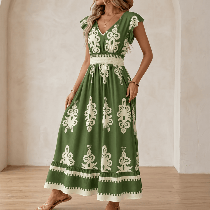 Woman wearing green baroque print maxi dress with smocked waist
