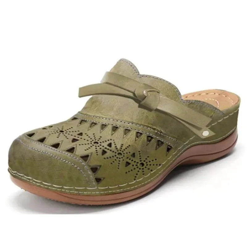 Womens slip-on clogs with cutout details and cute bow accent