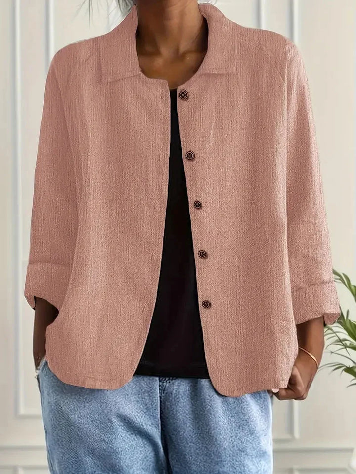 Woman wearing pink button-through casual jacket