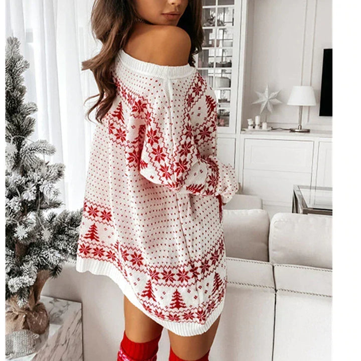 Close-up of oversized holiday sweater fabric featuring festive winter knit pattern