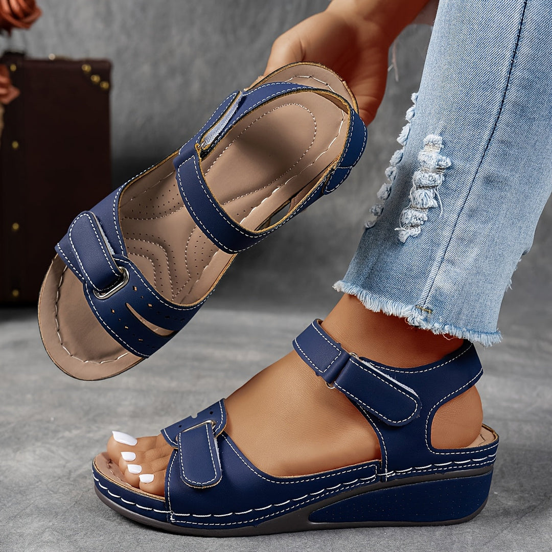 Side view of supportive orthopedic sandals highlighting ergonomic wedge heel height