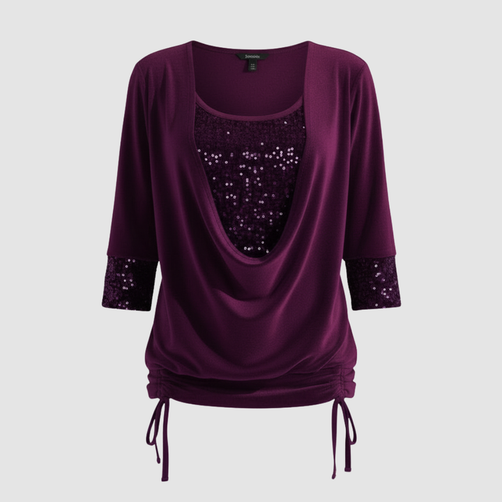 Purple sequin long-sleeve blouse displayed on a neutral background.