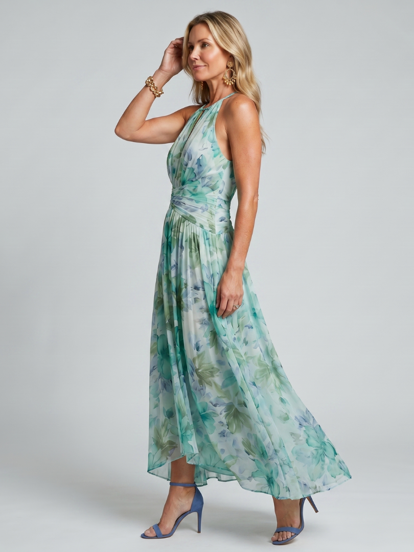 Side profile view of a woman showcasing the flowing silhouette of the maxi dress