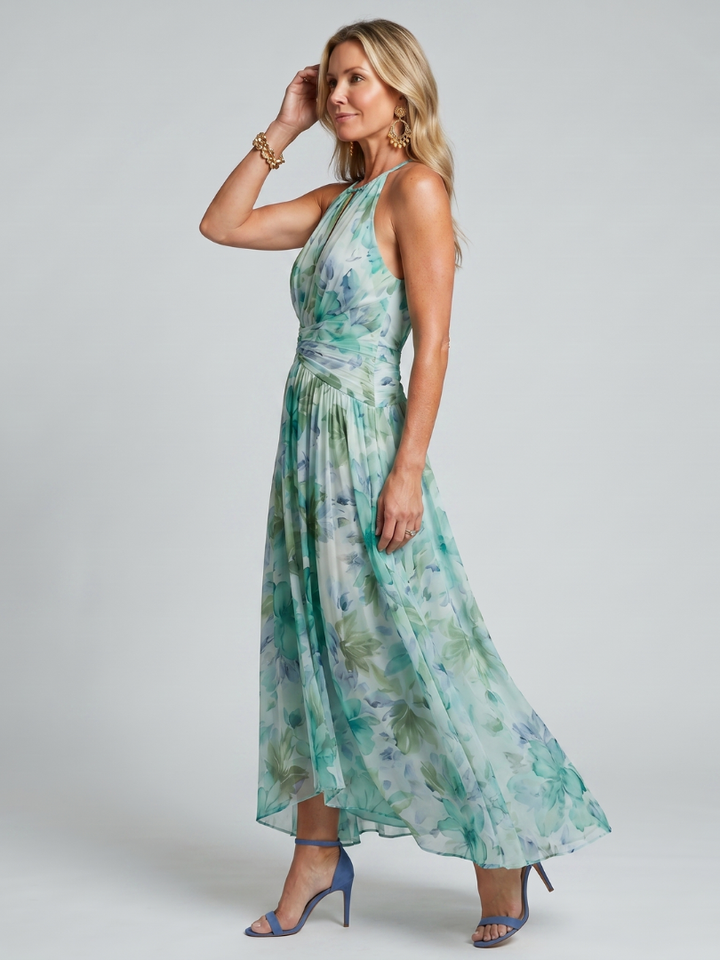 Side profile view of a woman showcasing the flowing silhouette of the maxi dress