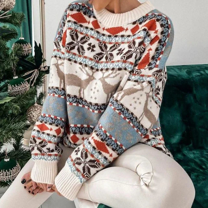 Close-up of cozy knit fabric on women's winter fashion holiday reindeer Christmas sweater