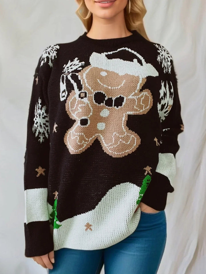 Woman wearing black festive gingerbread man Christmas sweater