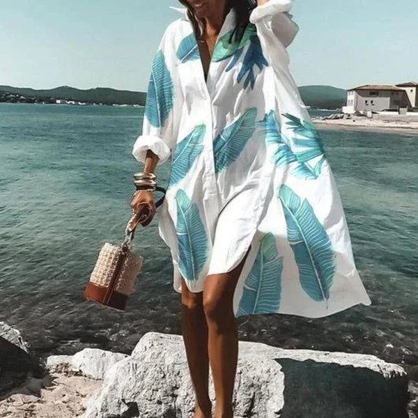 Woman wearing feather print long sleeve beach cover-up top