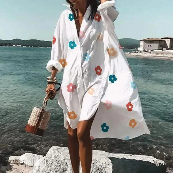 Woman wearing floral print long sleeve beach cover-up top