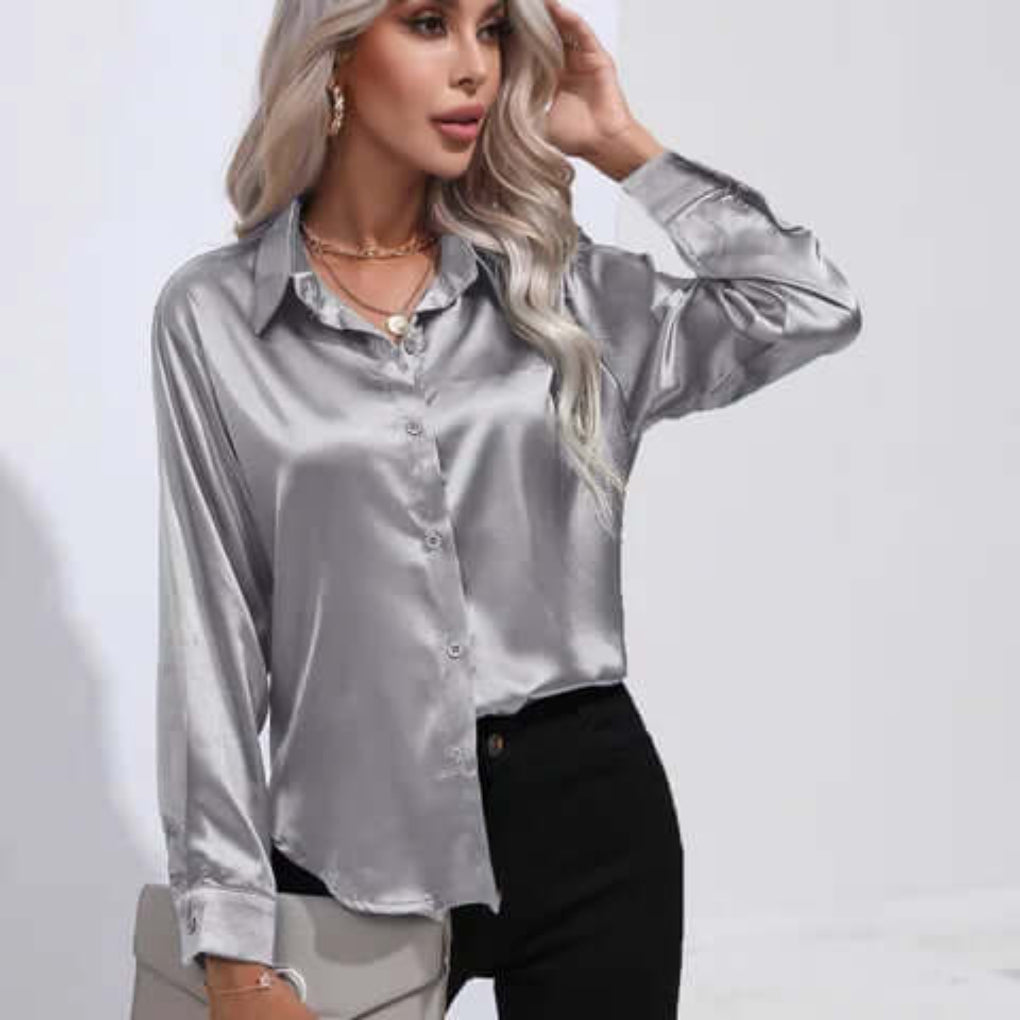 Model wearing a silver grey long sleeve satin button-up shirt