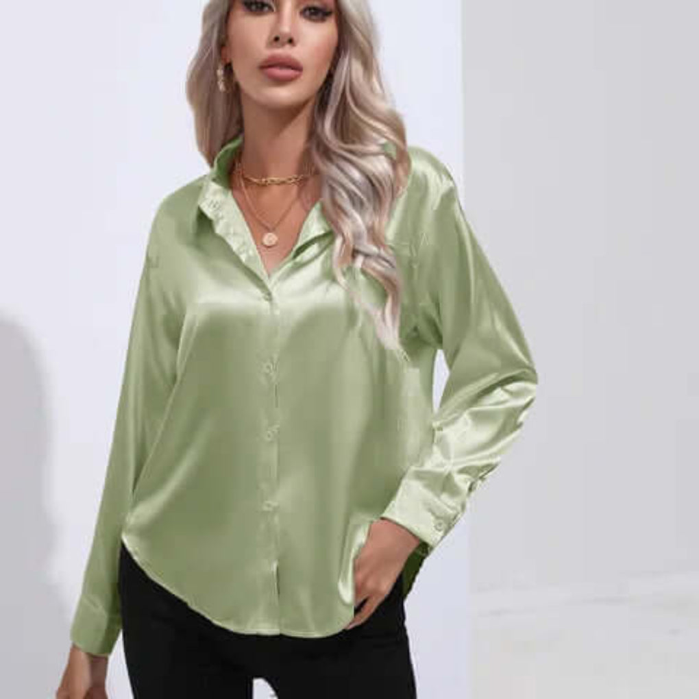 Model wearing a light green satin blouse with classic collar