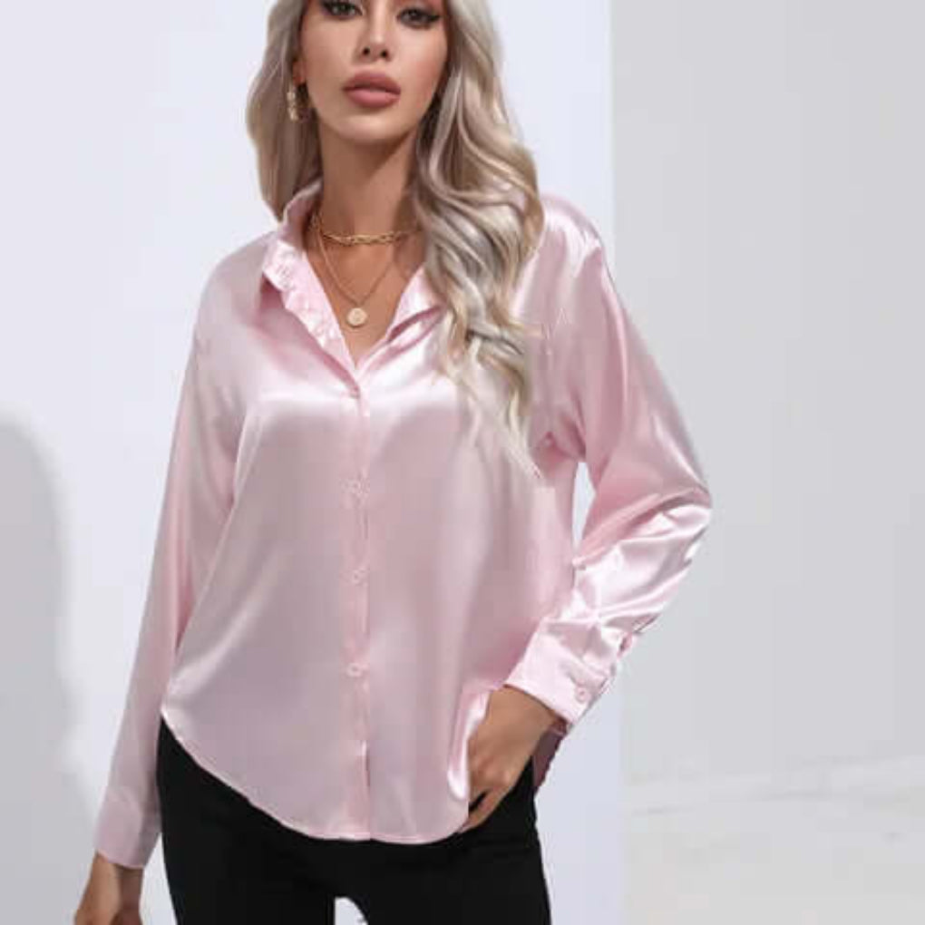 Elegant women's satin top featuring long sleeves with buttoned cuffs