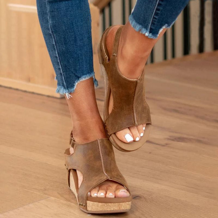 Angle shot of orthopedic wedge sandals highlighting arch support features
