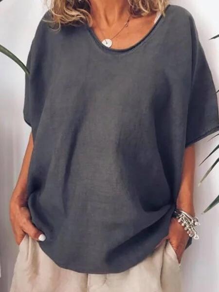 Woman wearing dark grey oversized short sleeve t-shirt