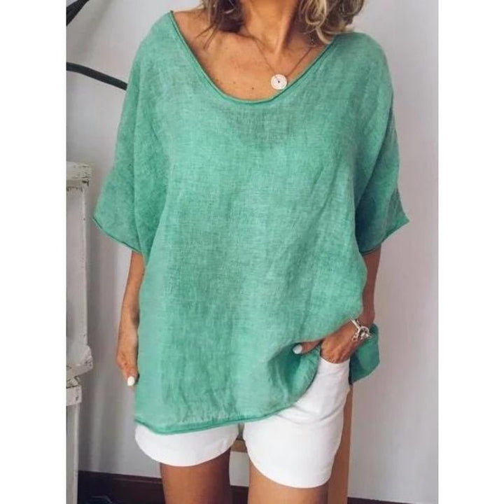 Women's summer t-shirt detail shot showing premium stitching and soft cotton fabric.