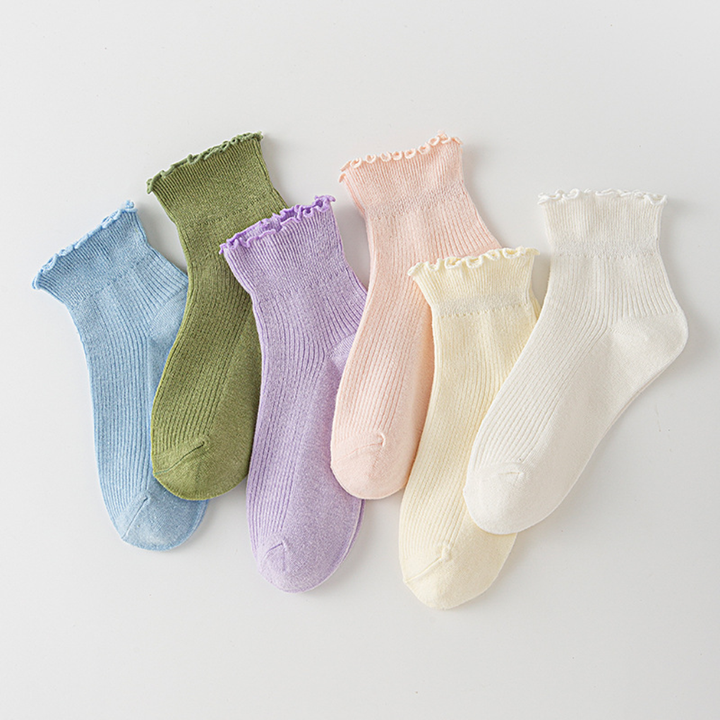 Women's pastel ruffled ankle socks in blue, green, purple, pink, yellow, and white color assortment
