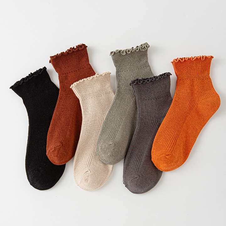 Women's earthy toned ruffled ankle socks in black, rust, beige, olive, charcoal, and orange
