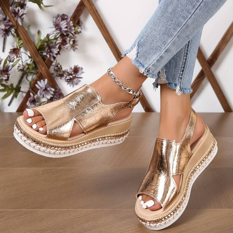 Side profile view of gold wedge platform sandals showing comfortable sole height