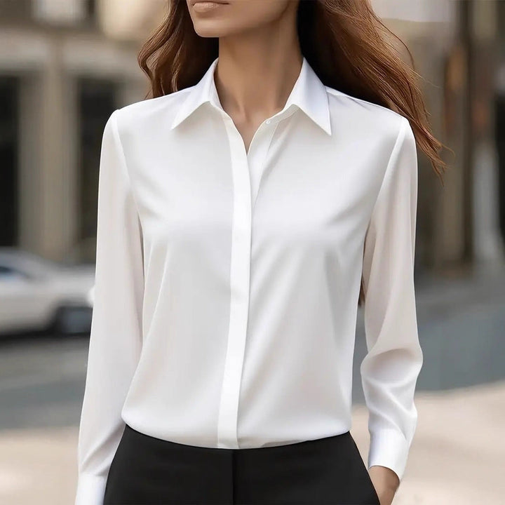 Woman wearing a white long sleeve elegant blouse outdoors